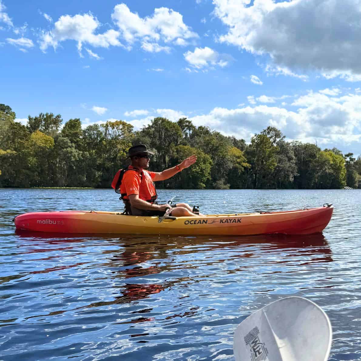 Paddle guide Dundee giving instructions from his kayak on the spring run at De Leon Springs State Park.